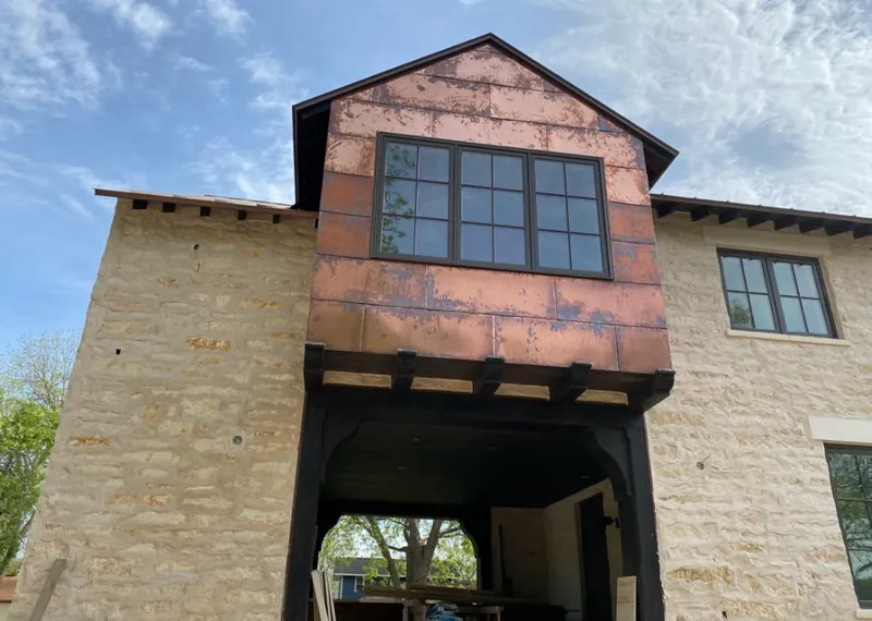 Copper metal panel facade on a stone building for Roof Repair in El Cajon